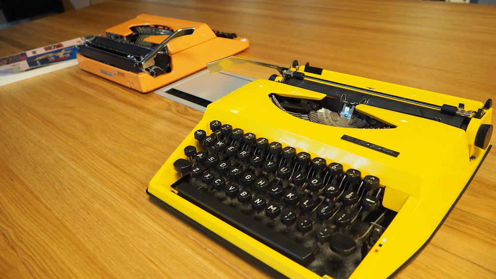 a yellow and black typewriter