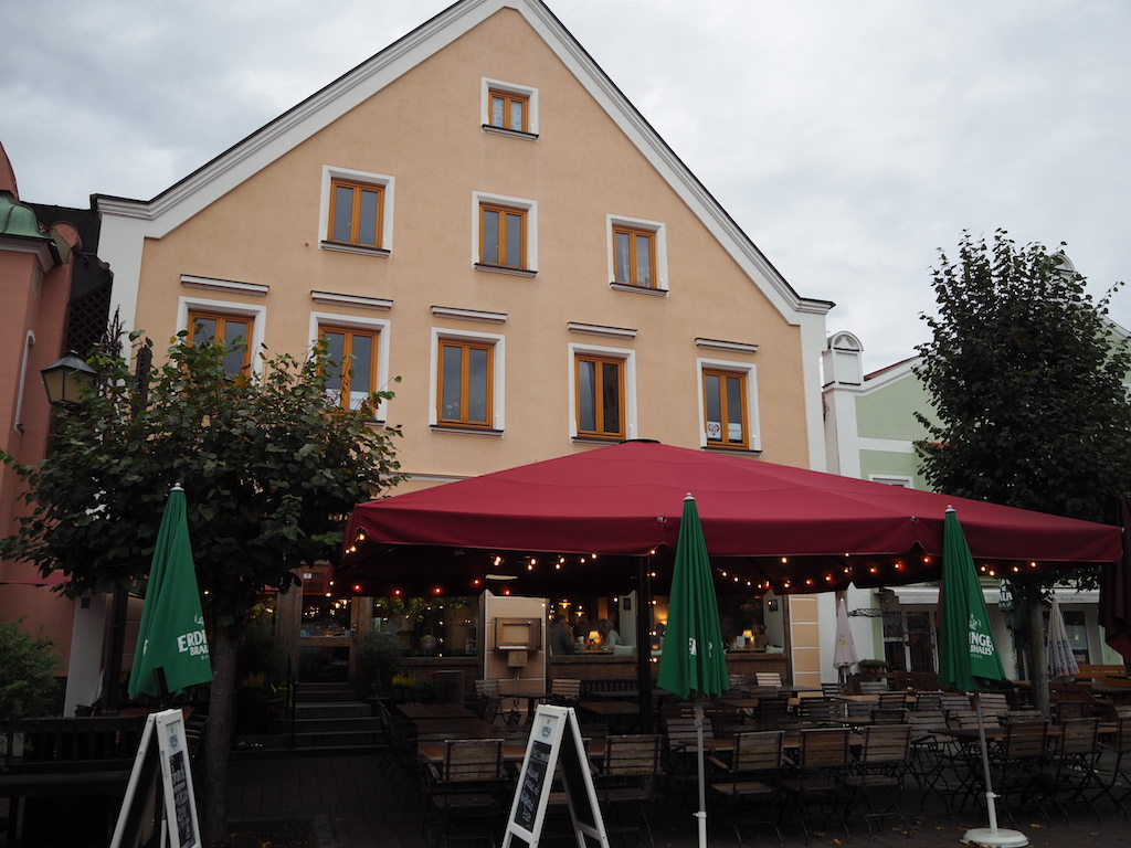 a building with tables and chairs outside