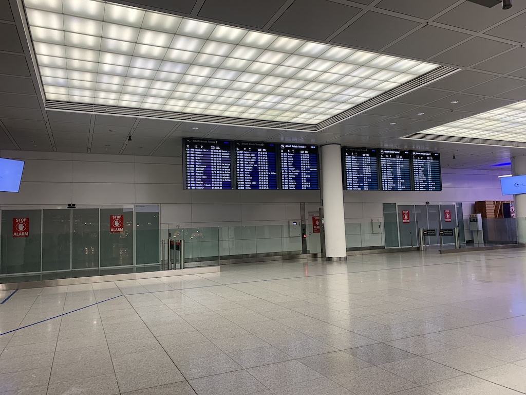 a large room with several screens