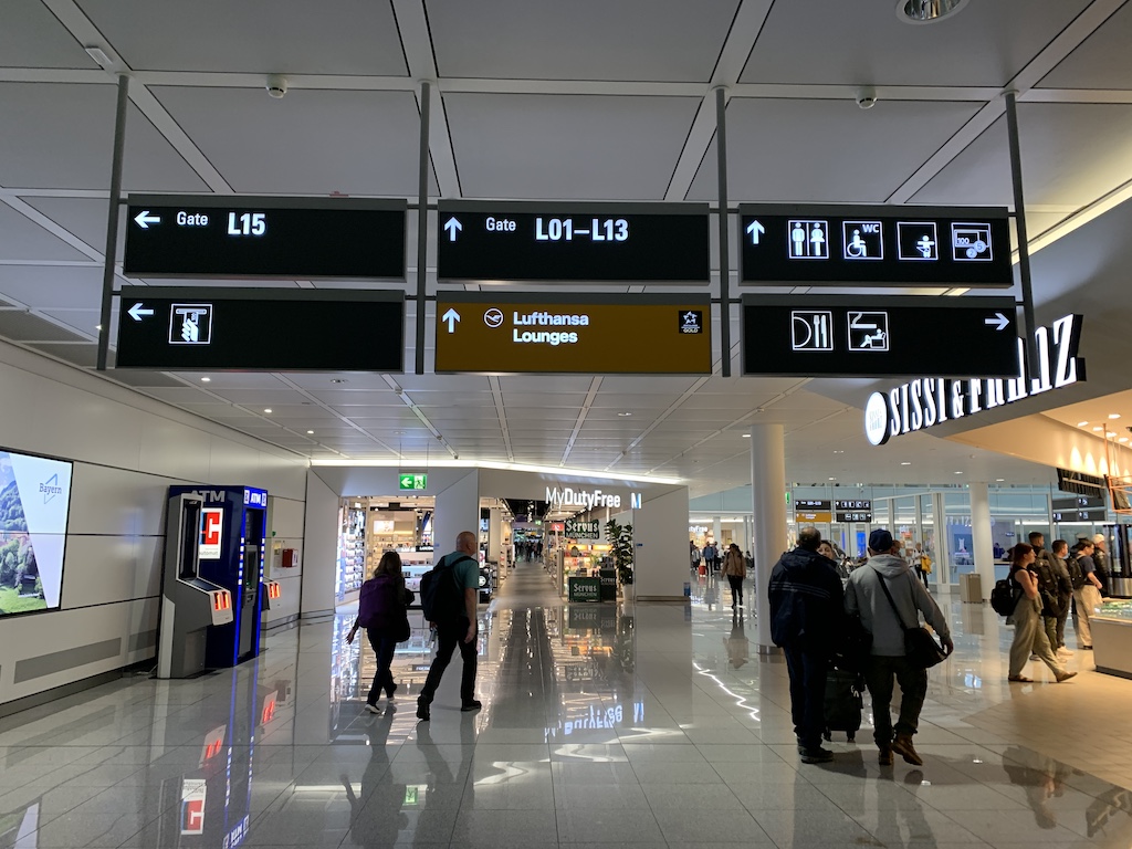 a group of people in a large airport terminal