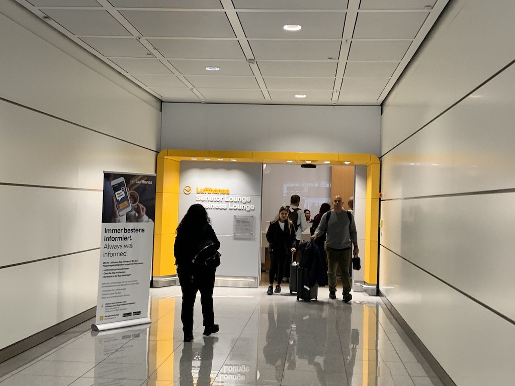 a group of people standing in a hallway