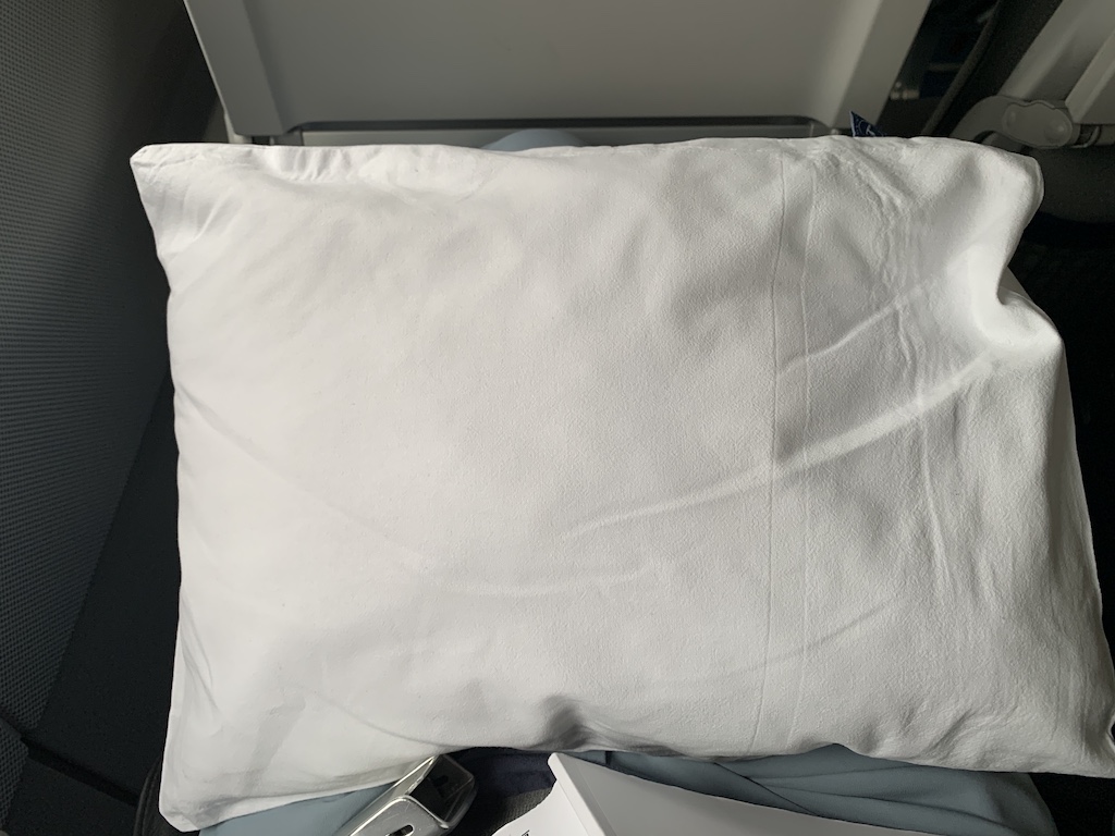 a white pillow on a couch