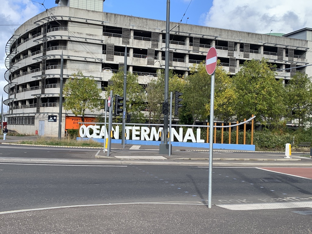 a sign in front of a building