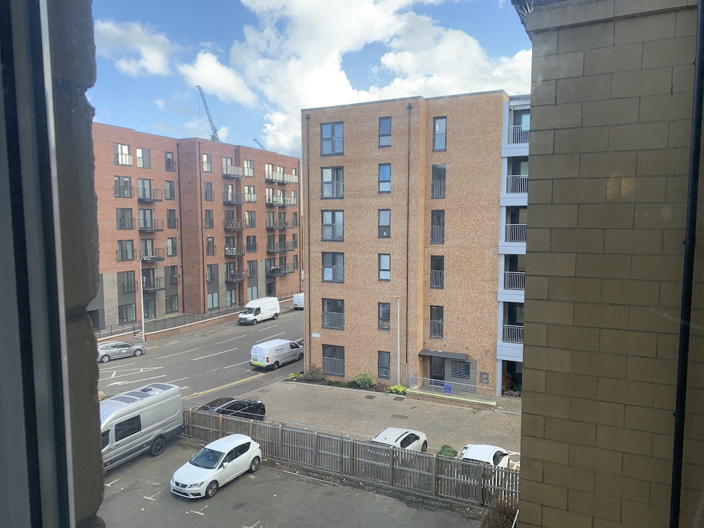 a building with cars parked in front