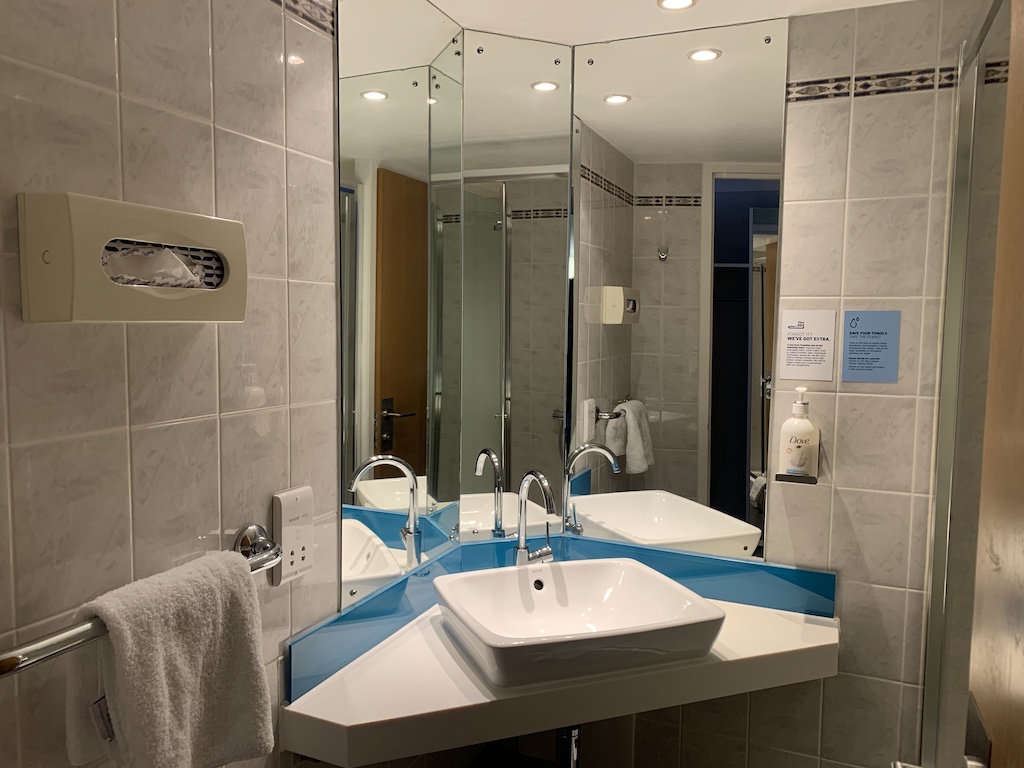 a bathroom with a large mirror