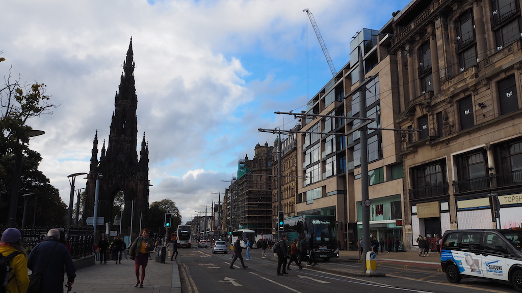 a street with buildings and people