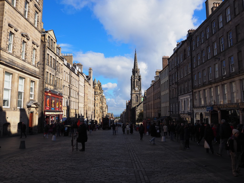 a group of people walking in a city