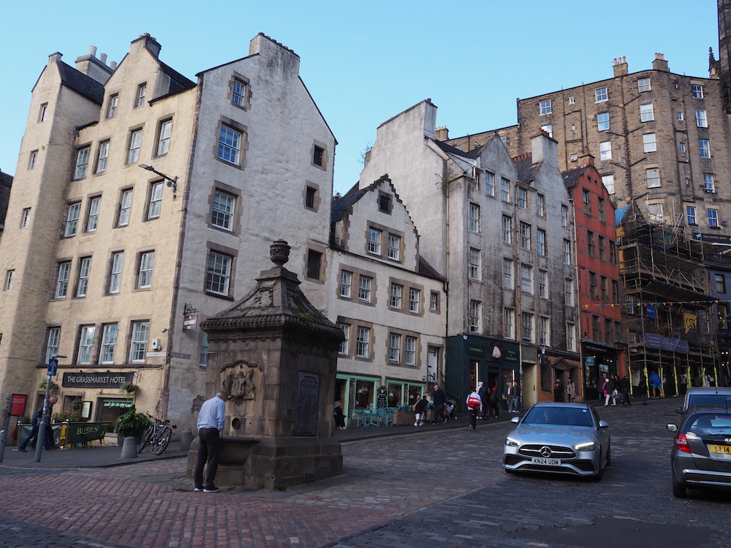 a street with cars and buildings along it