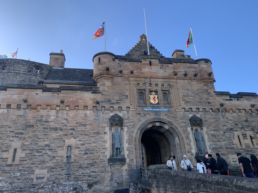 a stone castle with flags