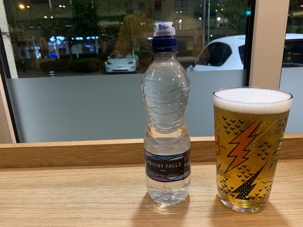 a bottle and a glass of beer on a table