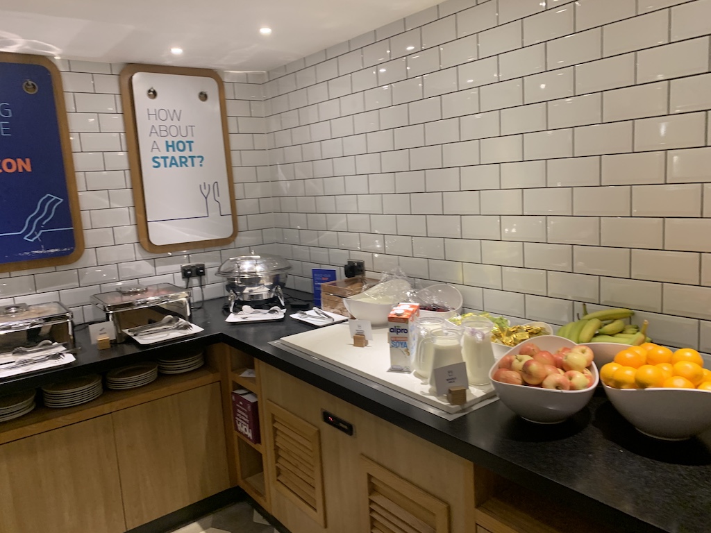 a kitchen with a counter top and a bowl of fruit