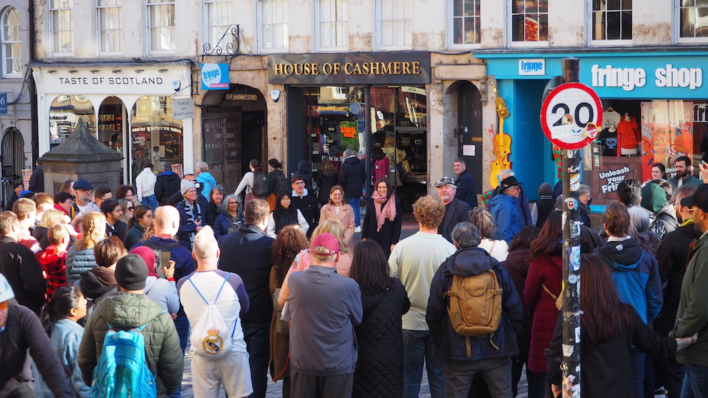 a crowd of people in front of a building