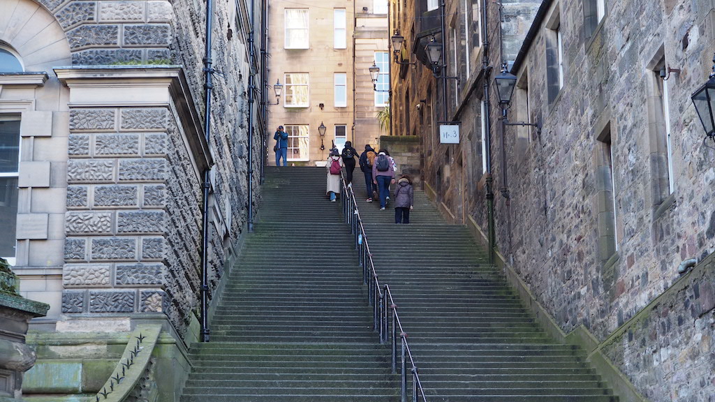 people walking up a flight of stairs