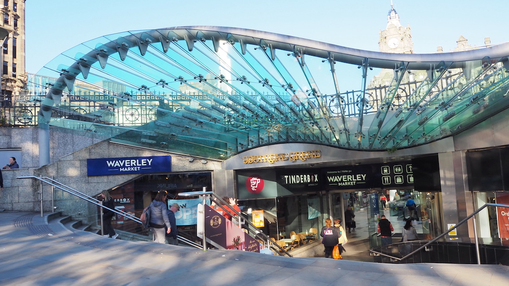 a large glass building with a glass roof