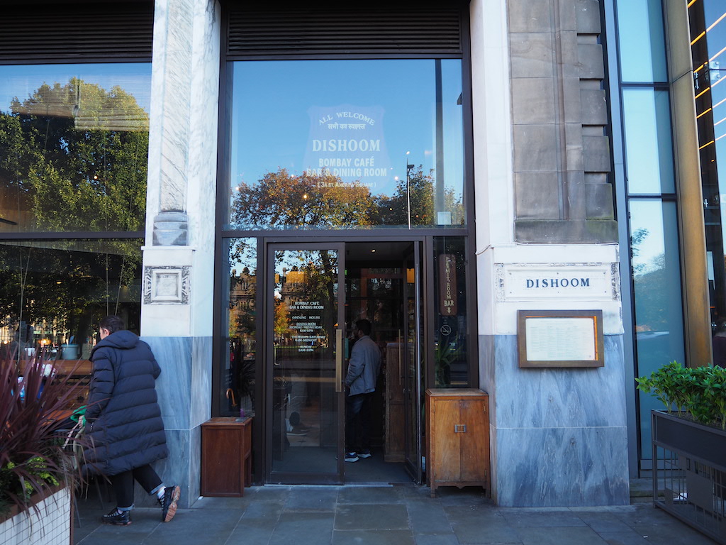 a person sitting in a doorway of a building