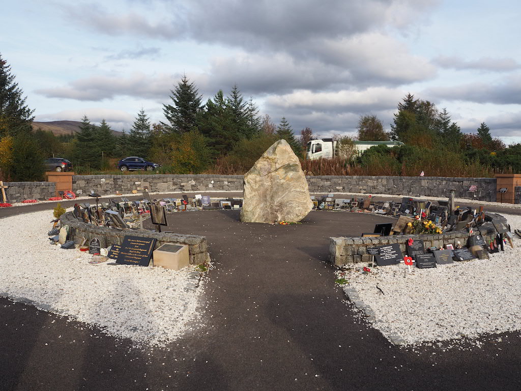 a construction site with a lot of rocks and a car parked