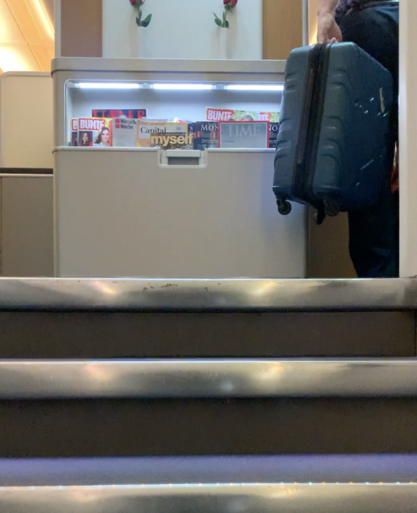 a white refrigerator with a black bag