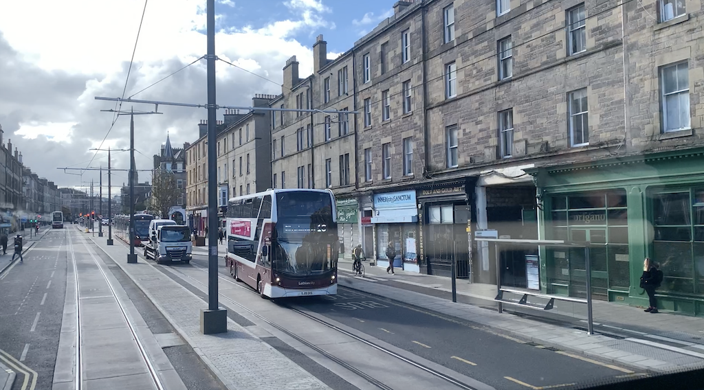 a bus travels down the street