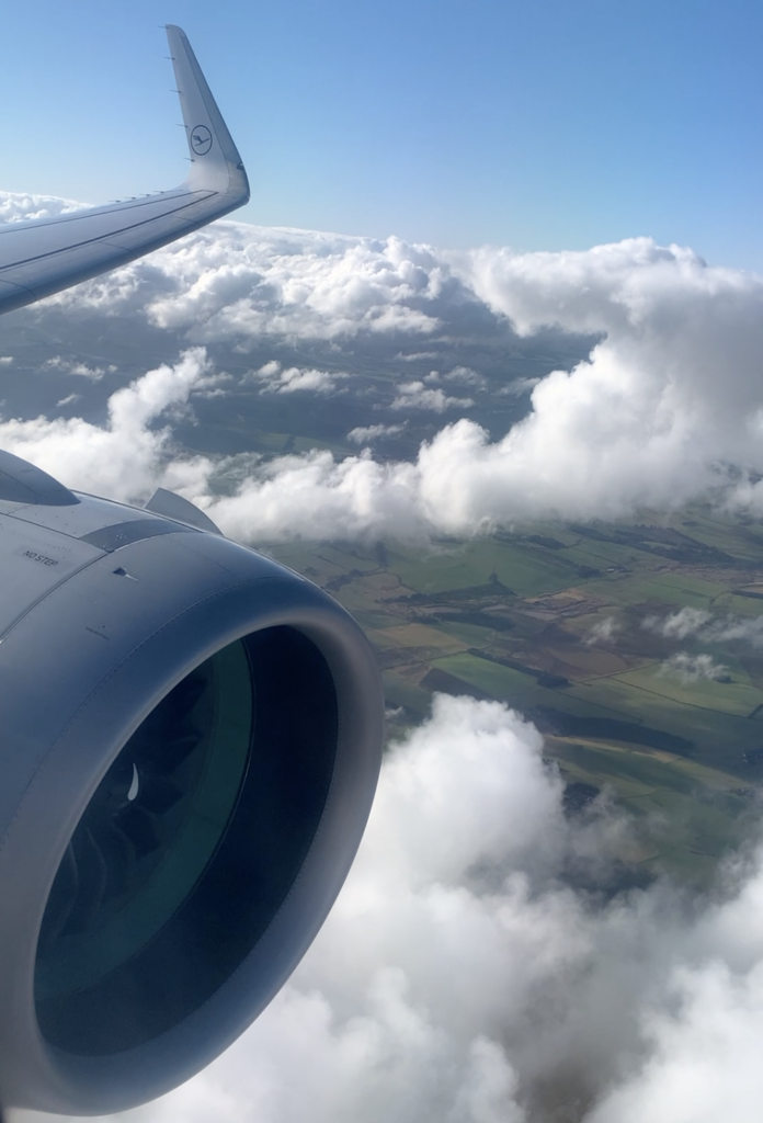 an airplane wing in the sky