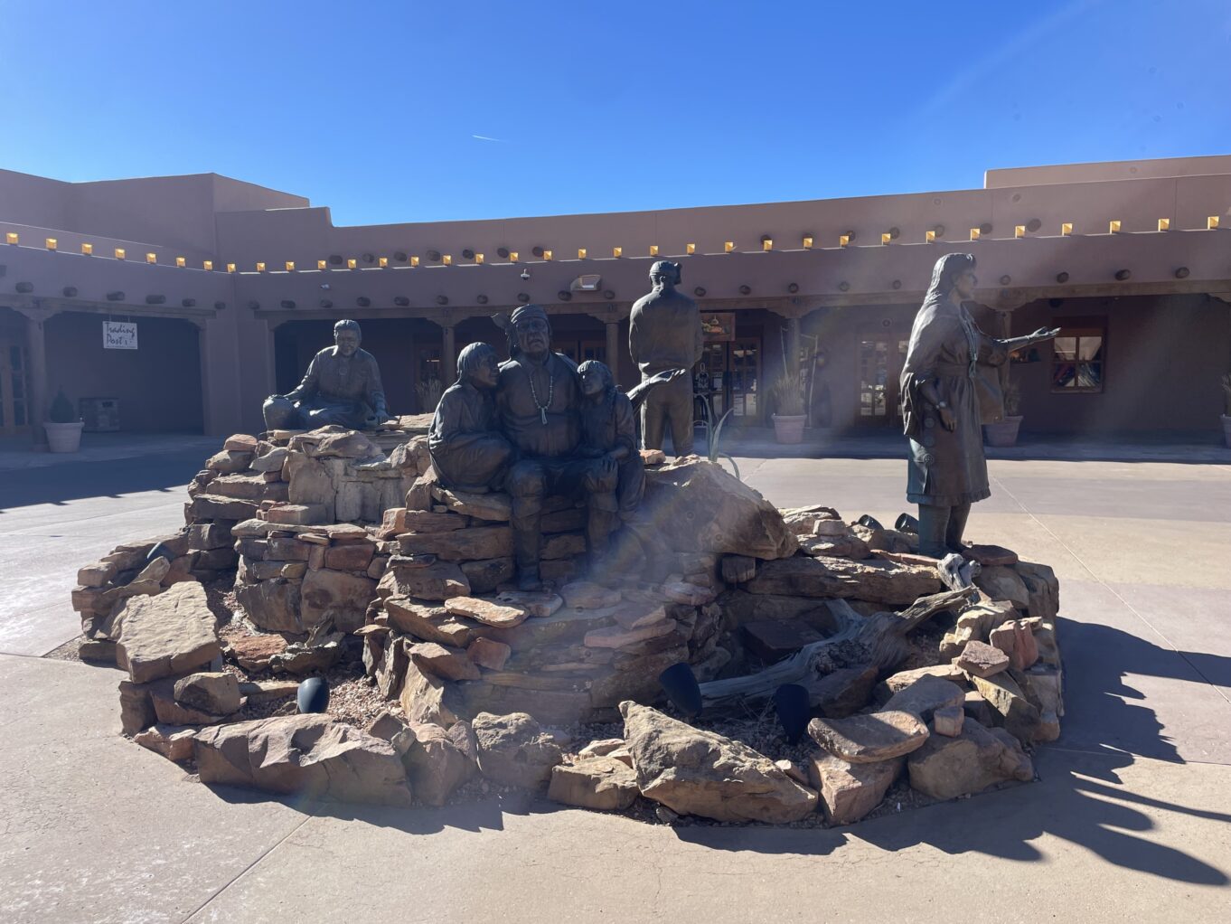 a group of statues outside a building