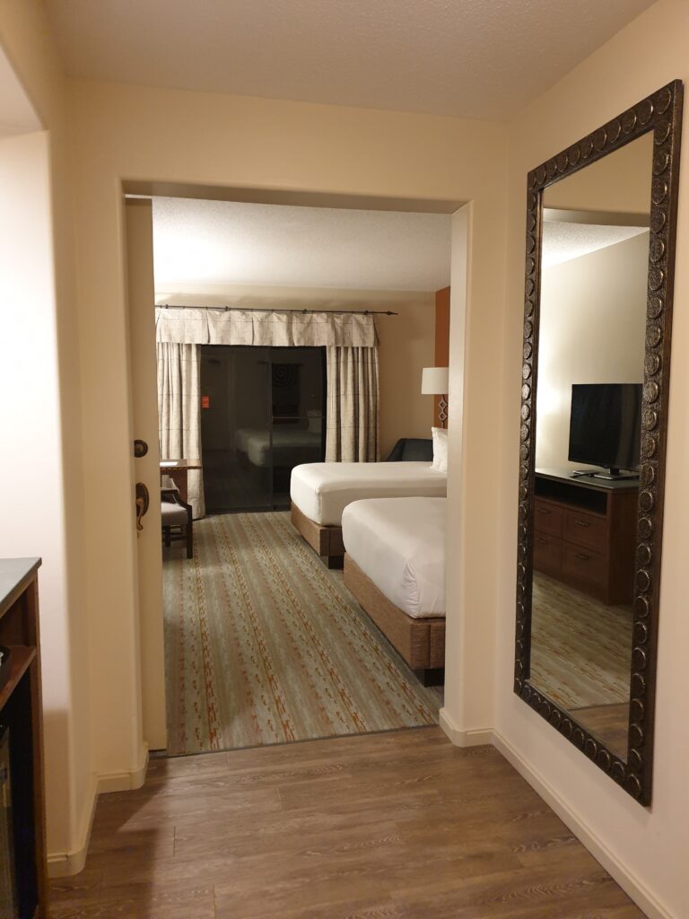 a bedroom with a large mirror