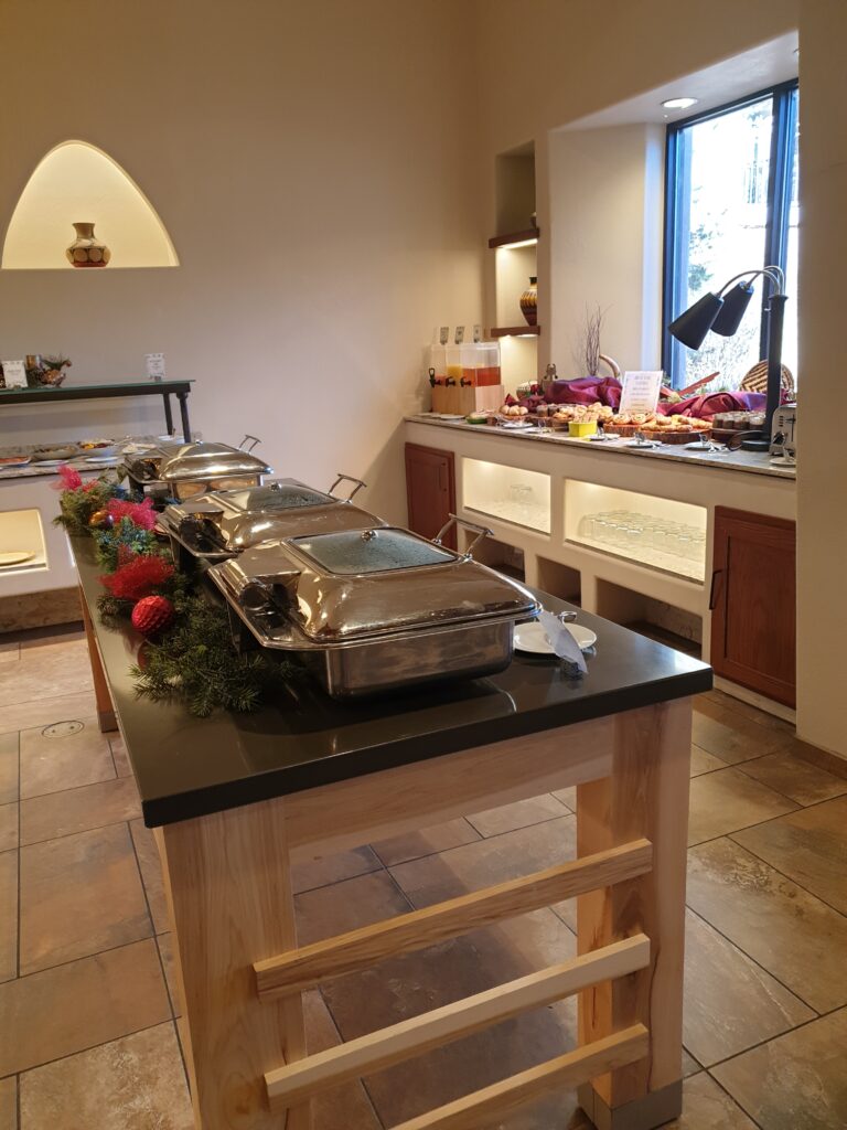 a kitchen with a table and flowers