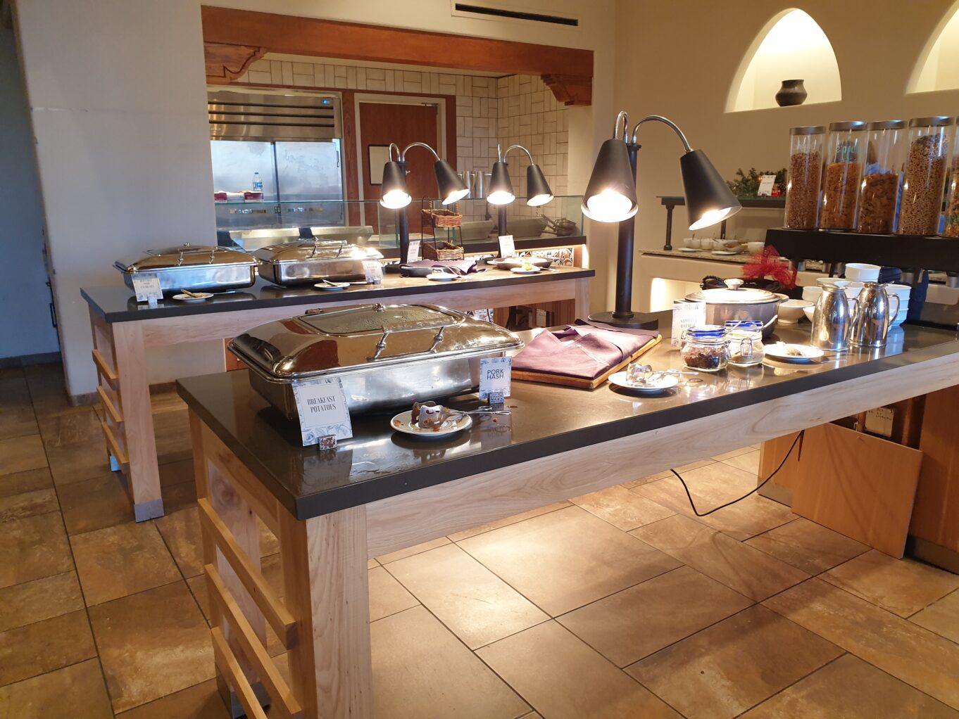 a kitchen with a large table full of food