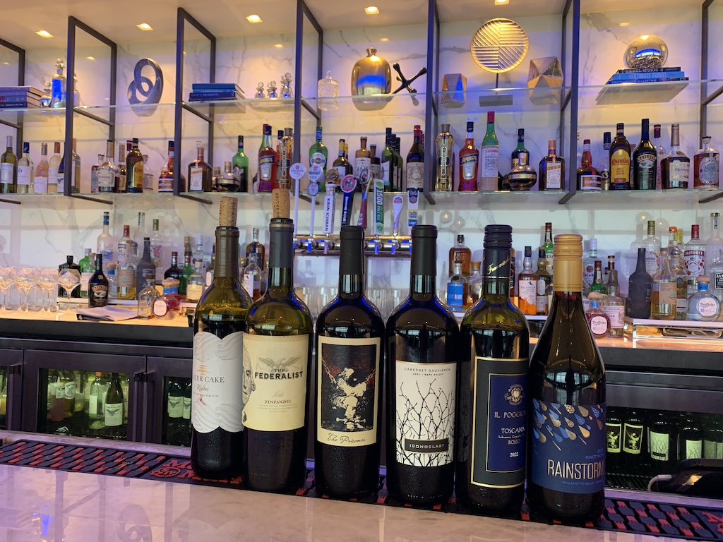 a bar with many bottles of wine