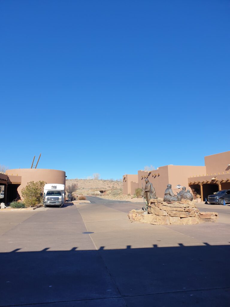 a road with a truck and a building on the side