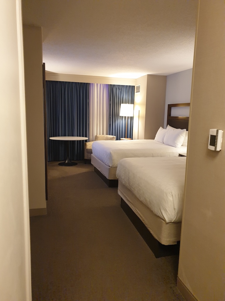 a hotel room with two beds