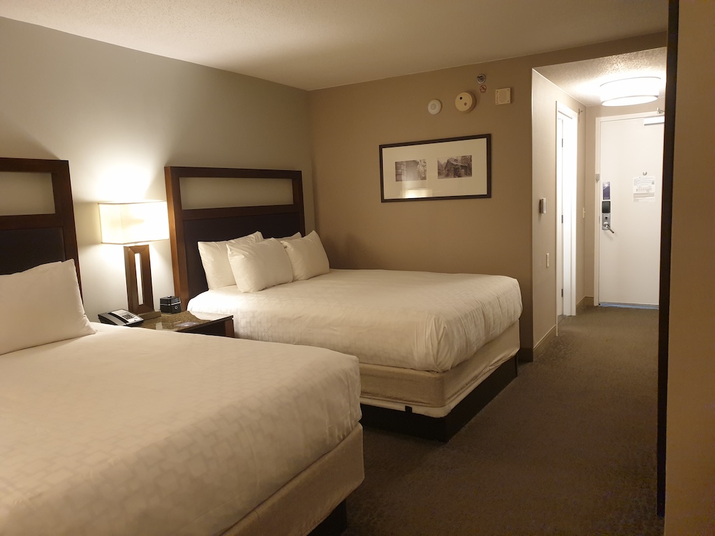 a hotel room with two beds