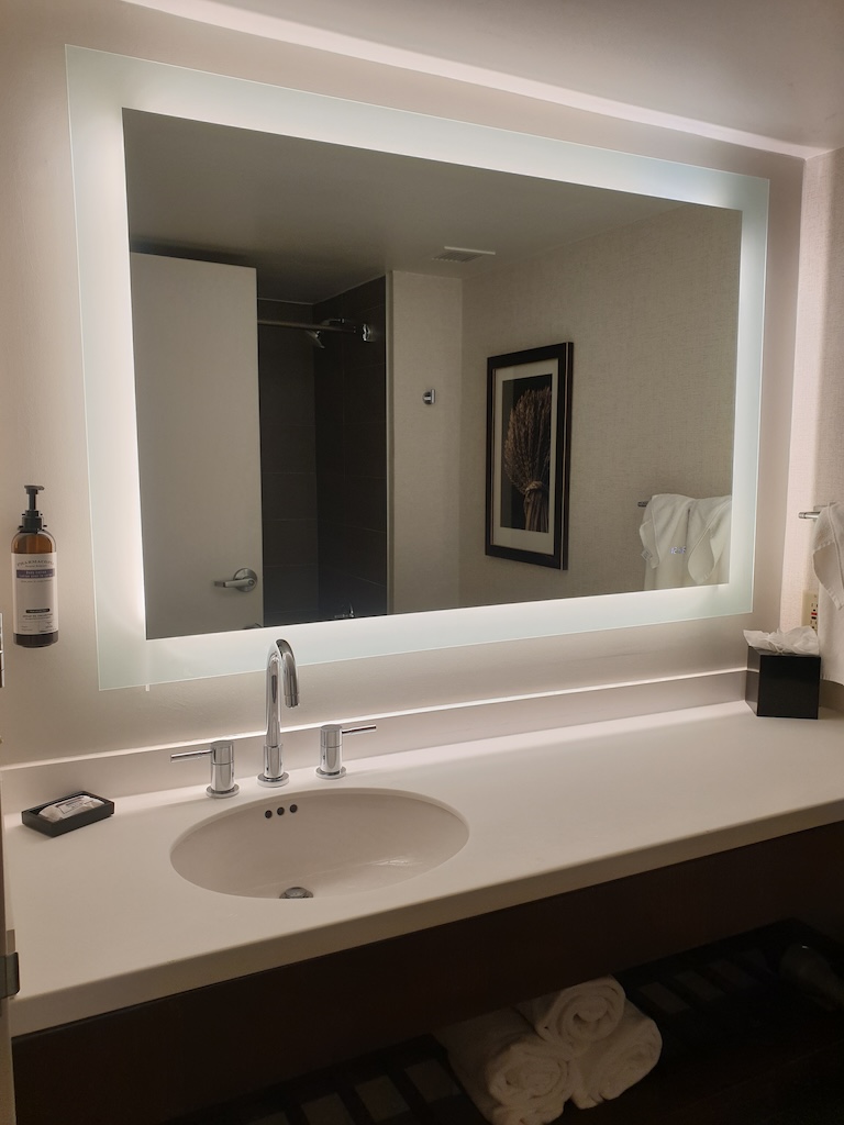 a bathroom with a large mirror