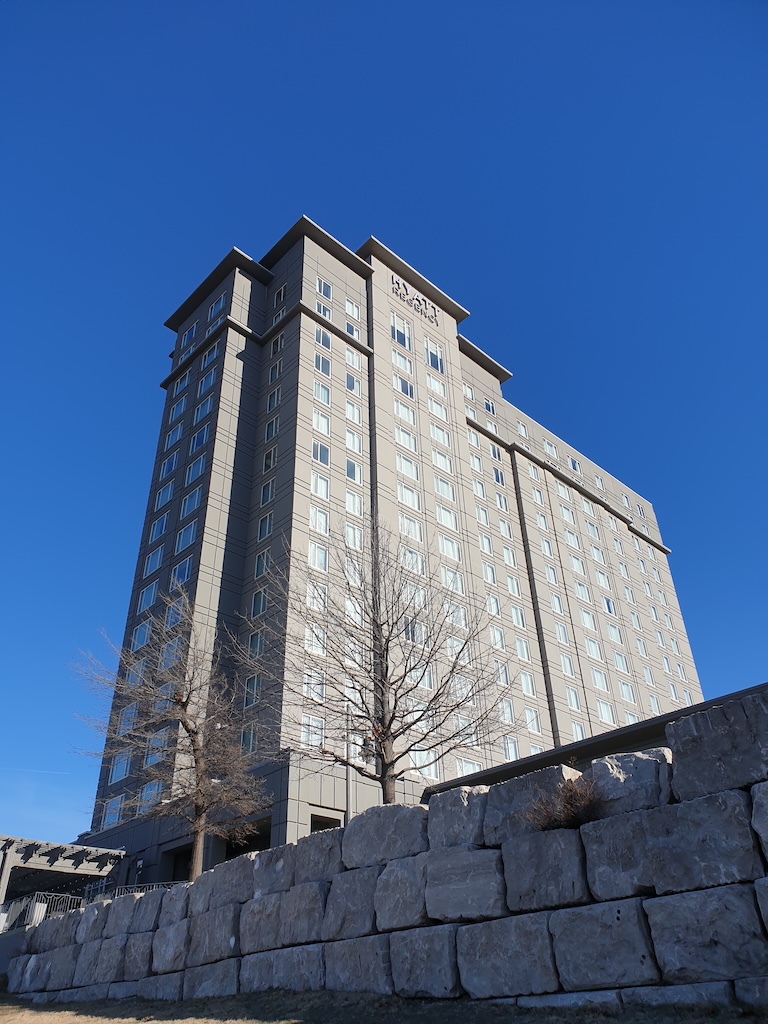 a tall building with a tree in front of it