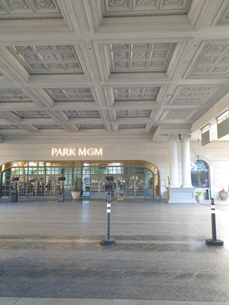 a large building with columns and a large glass ceiling