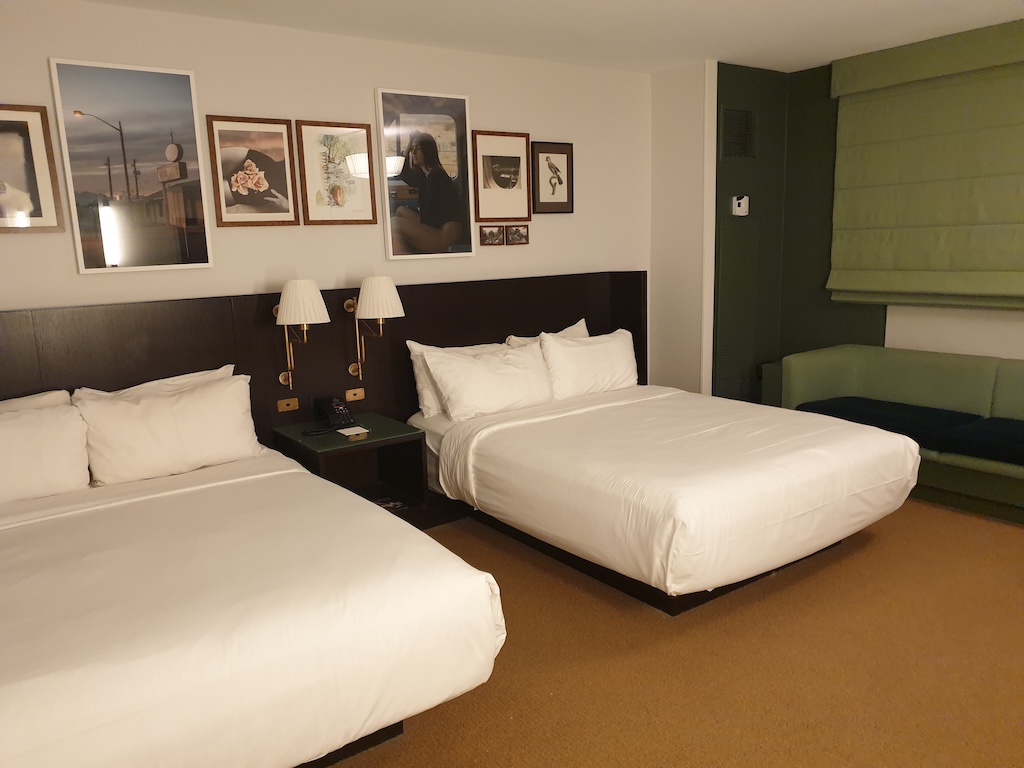 a hotel room with two beds