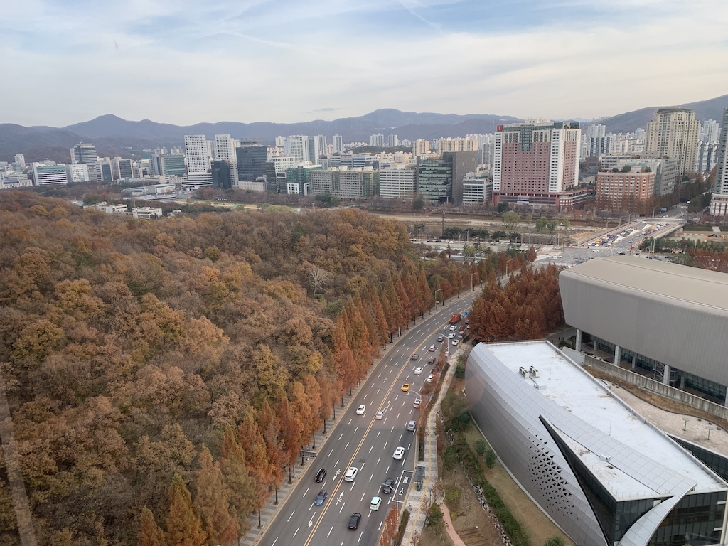 a city with a highway and cars