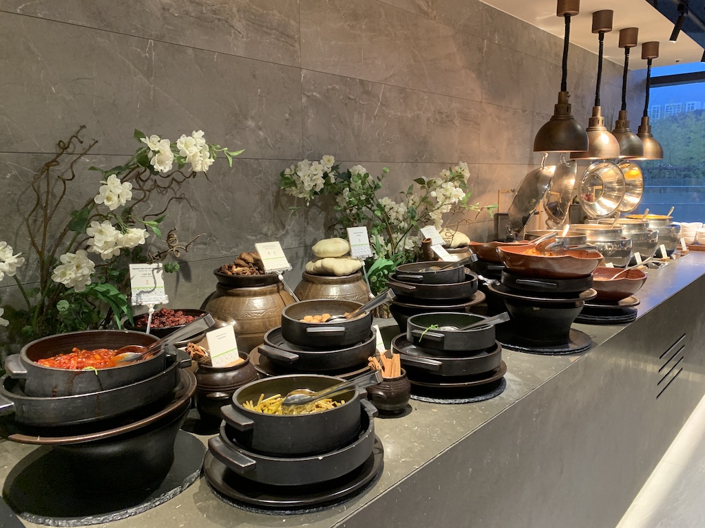 a table full of pots and flowers