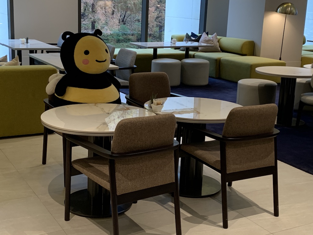 a room with a table chairs and a cartoon character on it