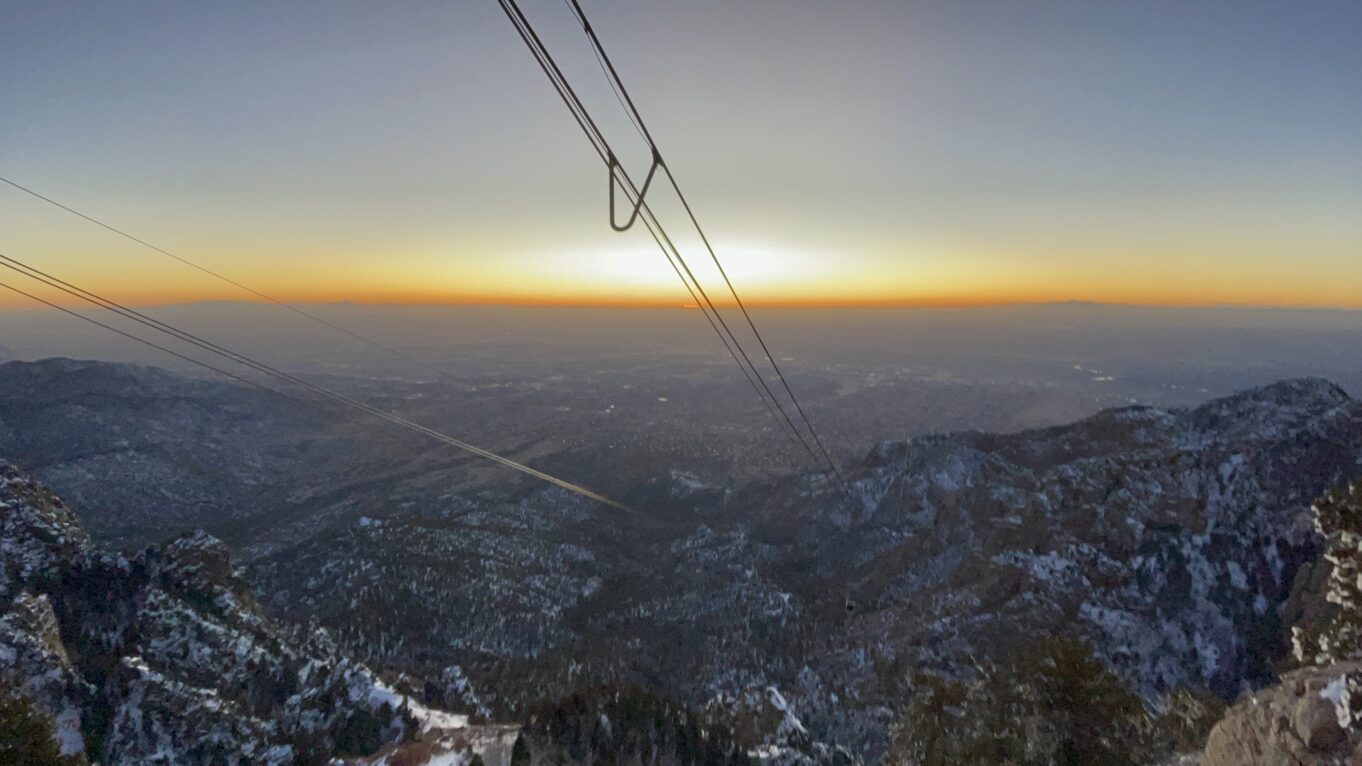 a view of a mountain range with a sunset