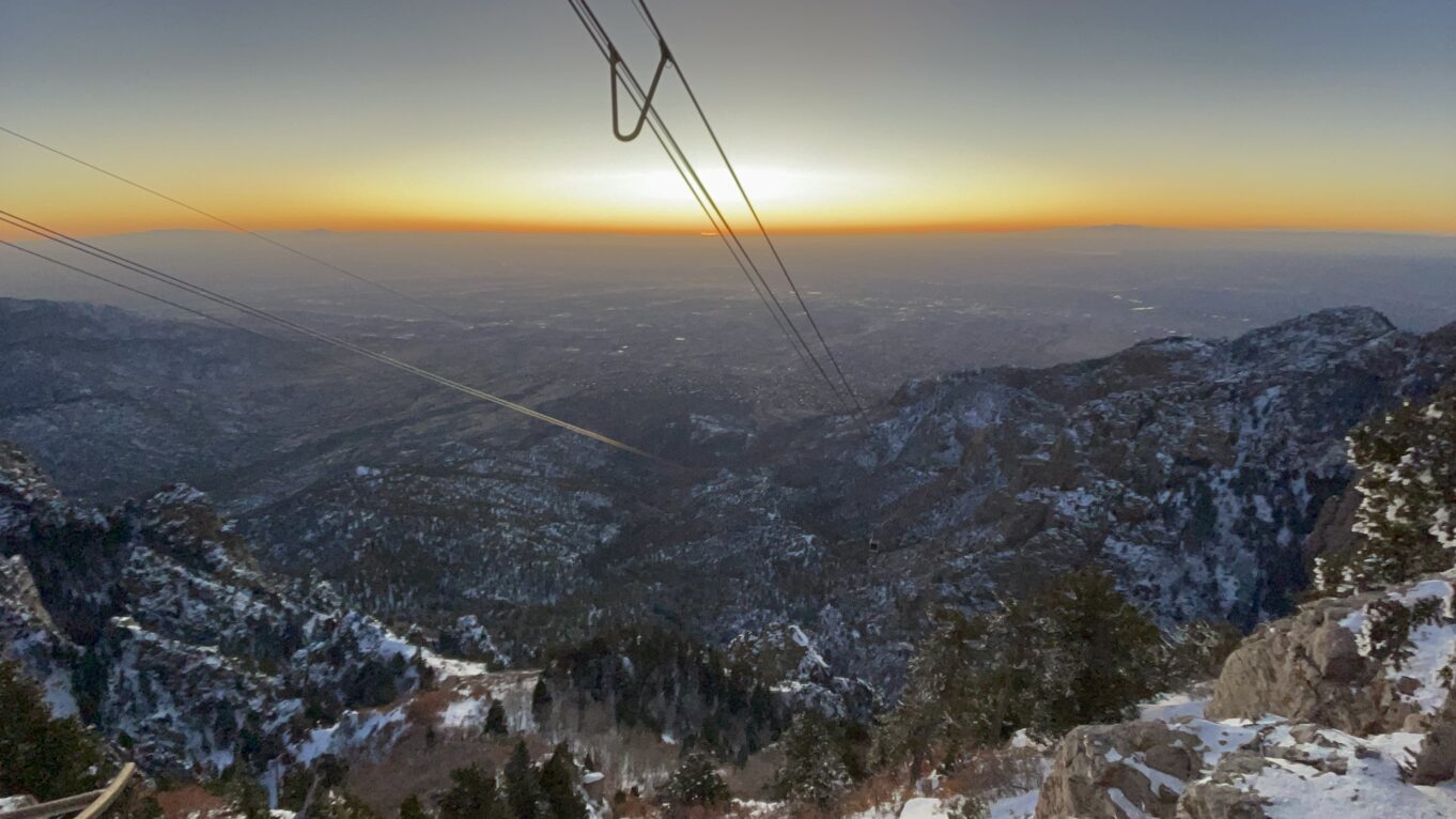 a view of a mountain range with a sunset