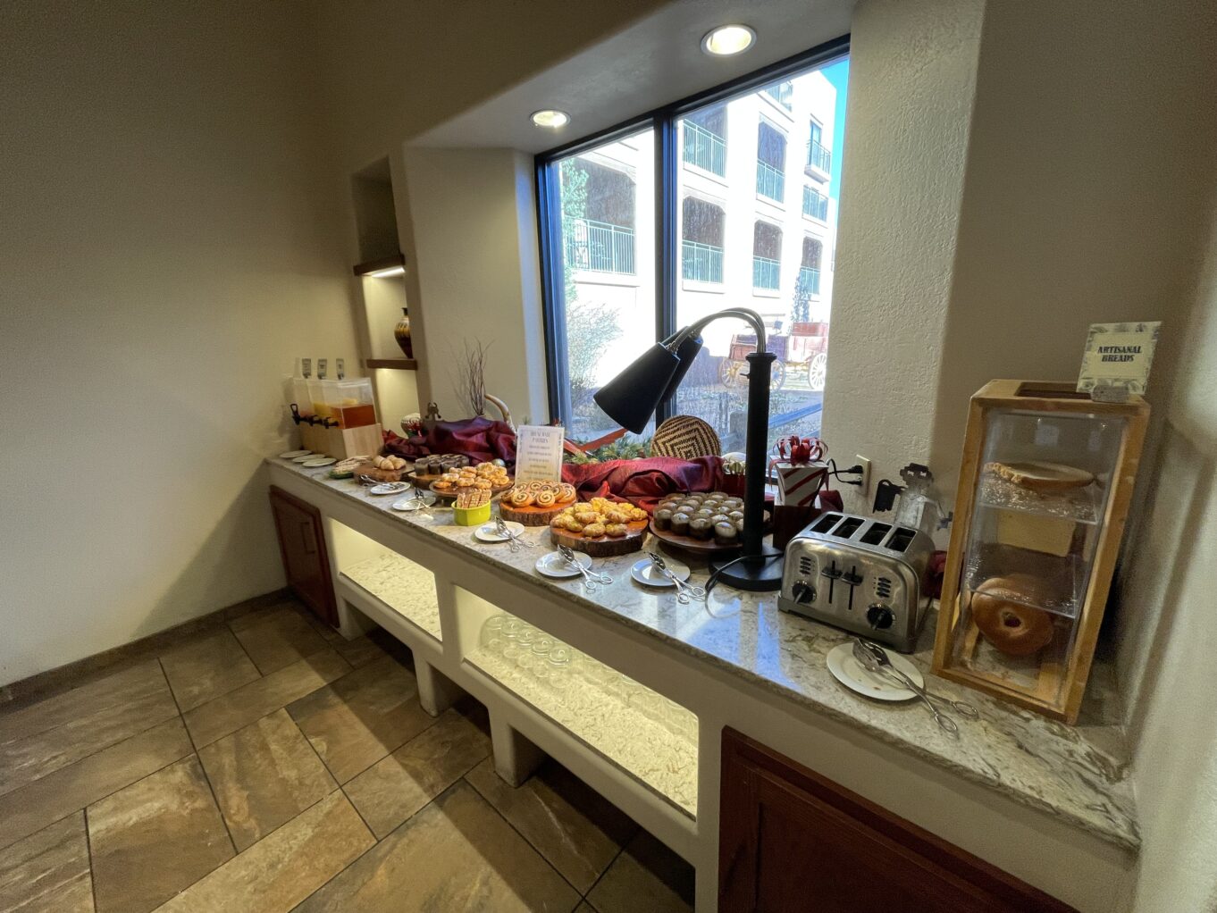 a kitchen with a counter top and a large window