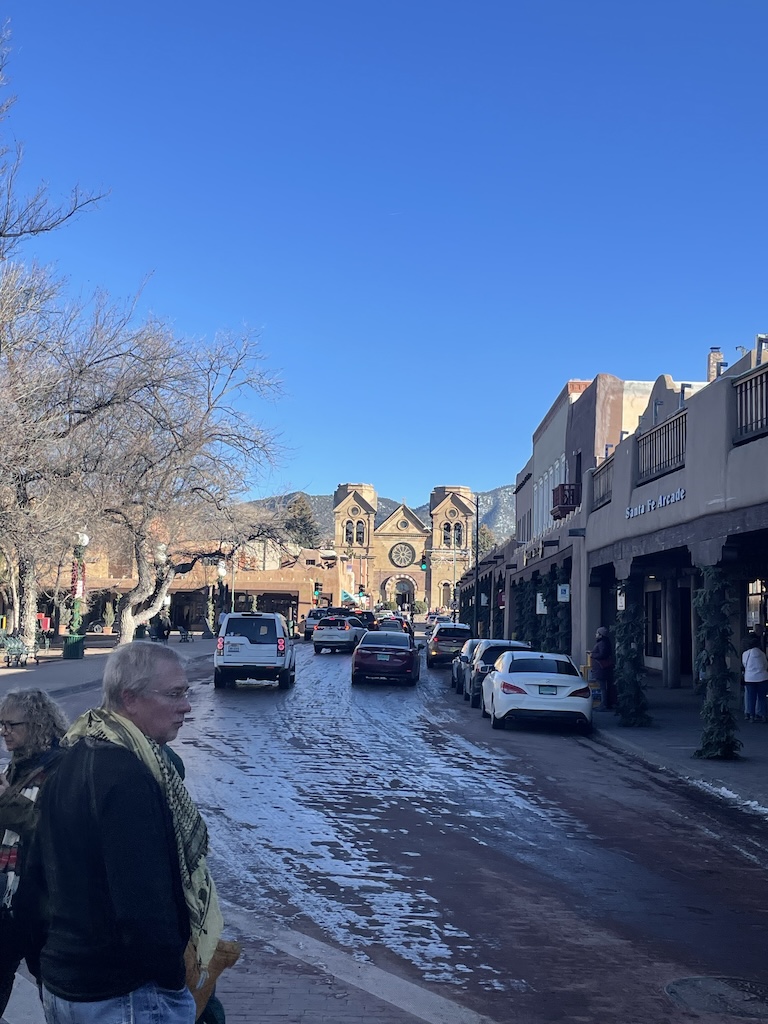 a street with cars and people on it