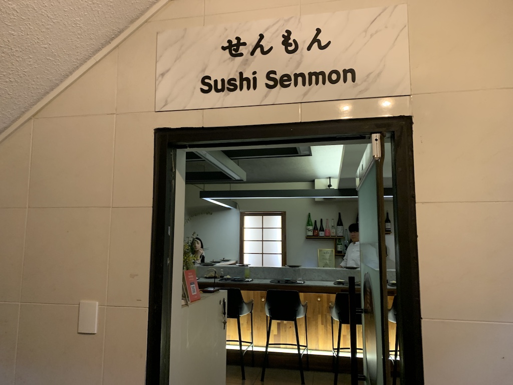 a restaurant with a sign above the door