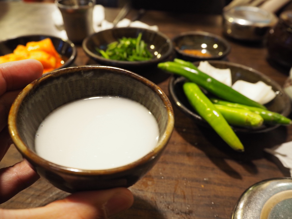 a person holding a bowl of food