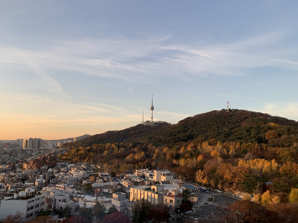 a city with a hill in the background