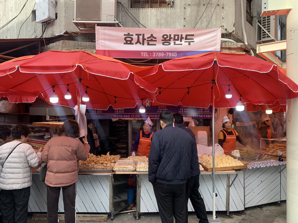 people standing near food vendors