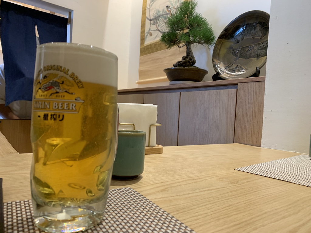 a glass of beer on a table