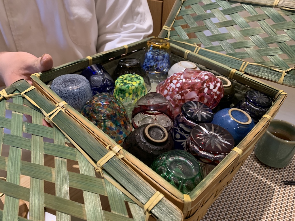 a basket full of glass bottles