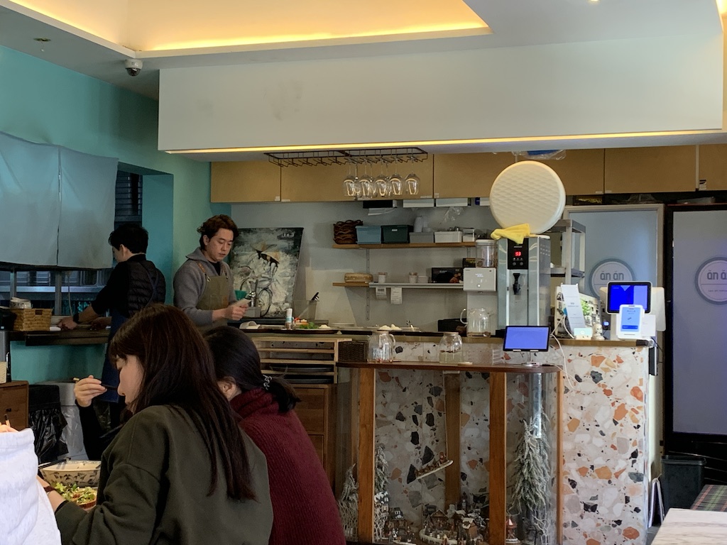 a group of people in a kitchen