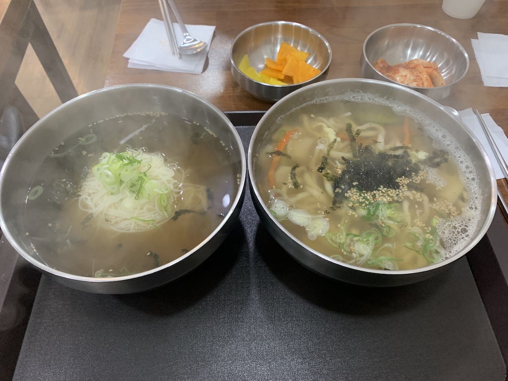 a table with bowls of food